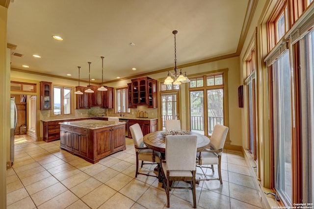 1104 Lois St, Kerrville, TX 78028 - dining room featuring ornamental molding, recessed lighting, a chandelier, and light tile patterned floors