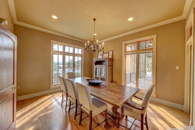 1104 Lois St, Kerrville, TX 78028 - dining area with a chandelier, light wood-type flooring, baseboards, recessed lighting, and crown molding