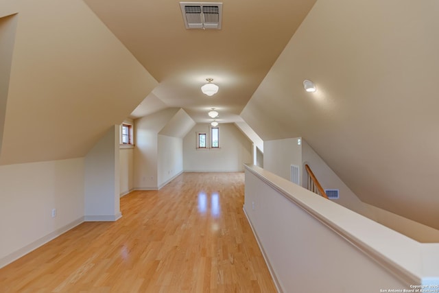 1104 Lois St, Kerrville, TX 78028 - bonus room featuring light wood finished floors, baseboards, and vaulted ceiling