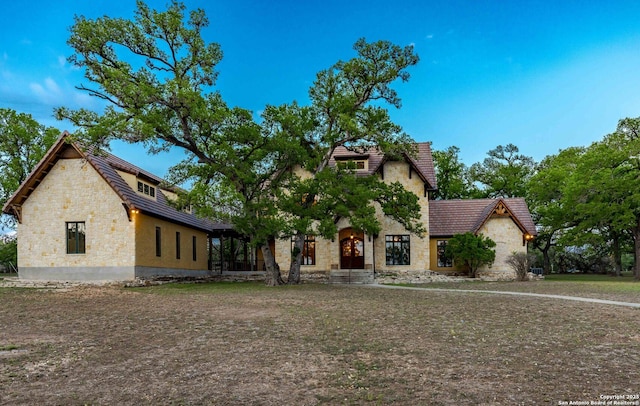 1104 Lois St, Kerrville, TX 78028 - tudor-style house with stone siding and stucco siding