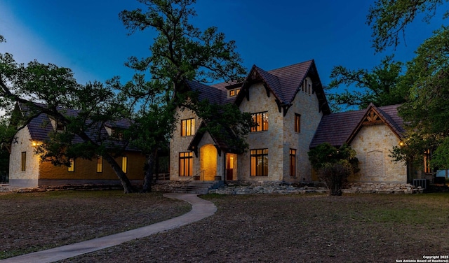 1104 Lois St, Kerrville, TX 78028 - view of front of home featuring stone siding and central AC