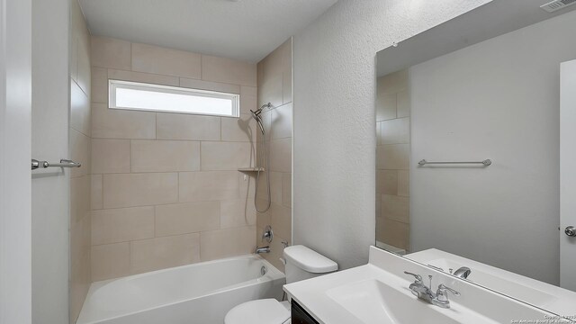 13154 Beals, San Antonio, TX 78253 - bathroom featuring toilet, vanity, and shower / washtub combination