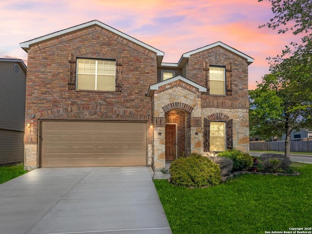 102 Ville Serene, San Antonio, TX 78253 - view of front of home featuring a garage, driveway, stone siding, a lawn, and brick siding