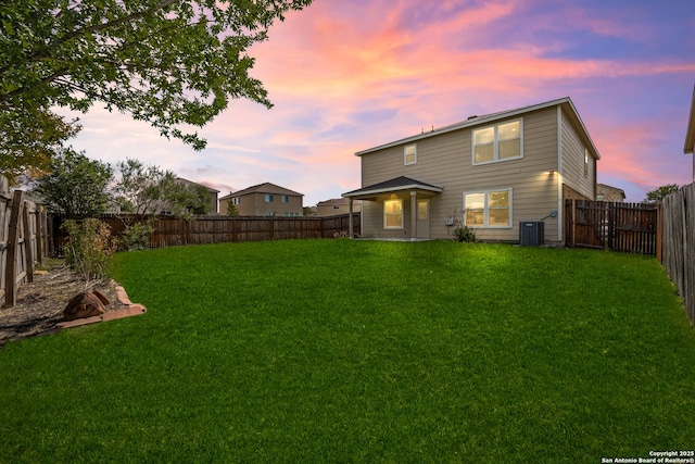 102 Ville Serene, San Antonio, TX 78253 - back of house at dusk featuring central air condition unit