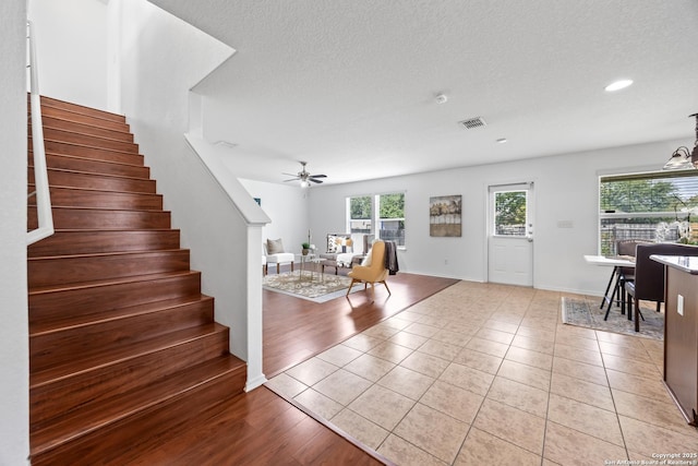 102 Ville Serene, San Antonio, TX 78253 - foyer entrance with stairway, a ceiling fan, recessed lighting, light tile patterned flooring, and a textured ceiling