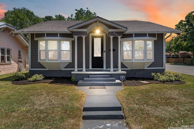 944 Fulton, San Antonio, TX 78201 - bungalow-style home with a front yard and a shingled roof