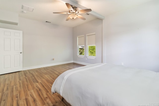 944 Fulton, San Antonio, TX 78201 - unfurnished bedroom featuring wood finished floors, baseboards, and a ceiling fan