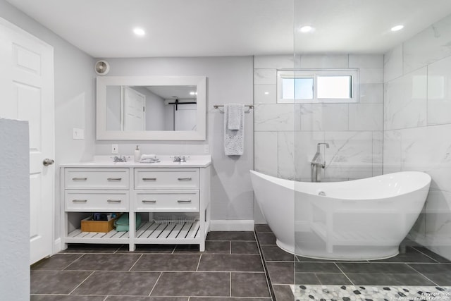 944 Fulton, San Antonio, TX 78201 - full bath with double vanity, a freestanding bath, tile patterned flooring, and recessed lighting