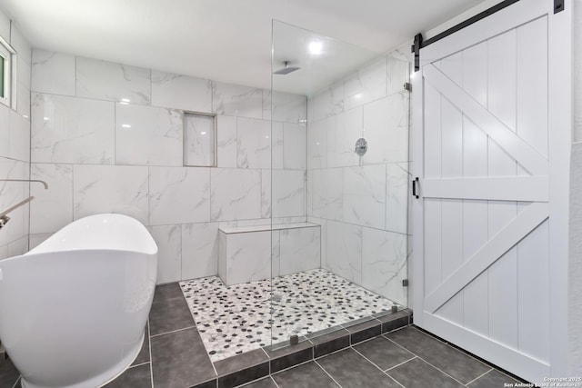 944 Fulton, San Antonio, TX 78201 - full bathroom featuring a stall shower, tile patterned flooring, a freestanding bath, and tile walls