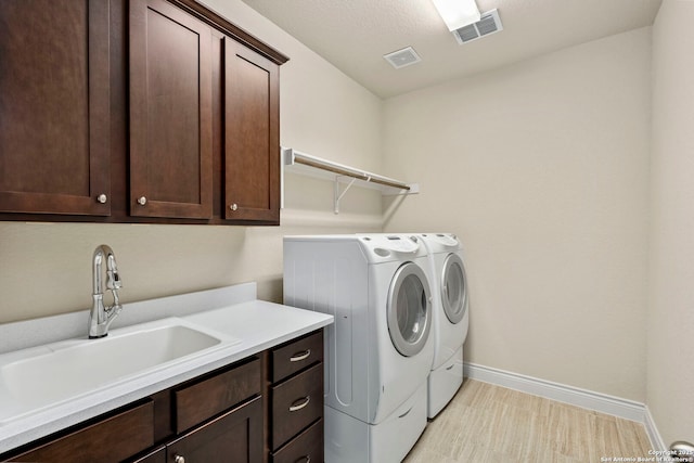 28114 Versant, Boerne, TX 78015 - washroom with washing machine and dryer and cabinet space