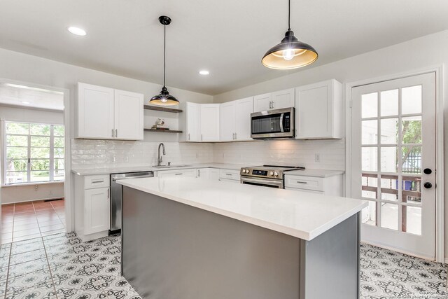 123 W Mandalay, San Antonio, TX 78212 - kitchen featuring stainless steel appliances, open shelves, a sink, light countertops, and recessed lighting