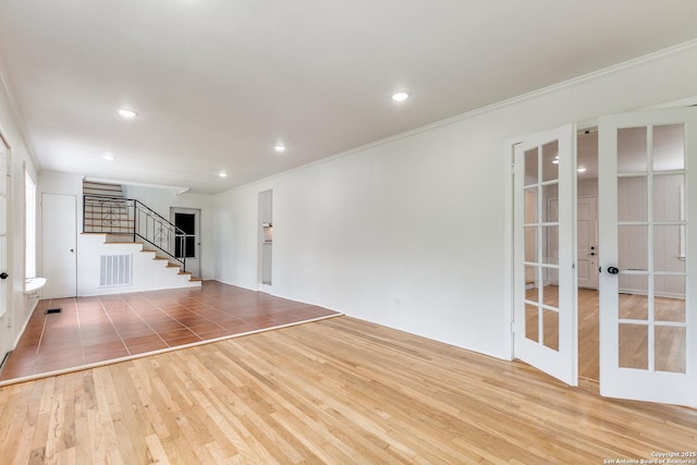 123 W Mandalay, San Antonio, TX 78212 - unfurnished living room with french doors, wood finished floors, stairway, ornamental molding, and recessed lighting