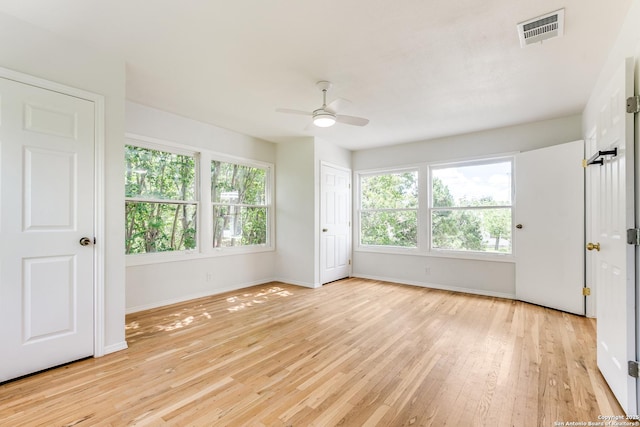 123 W Mandalay, San Antonio, TX 78212 - unfurnished bedroom with light wood-type flooring, baseboards, and ceiling fan