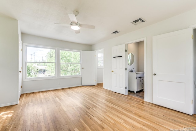 123 W Mandalay, San Antonio, TX 78212 - unfurnished bedroom with a sink, light wood finished floors, baseboards, and a ceiling fan