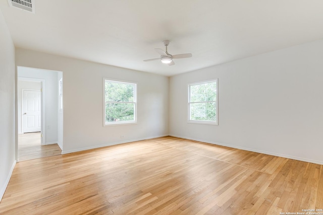 123 W Mandalay, San Antonio, TX 78212 - empty room featuring light wood-style flooring, baseboards, and a ceiling fan