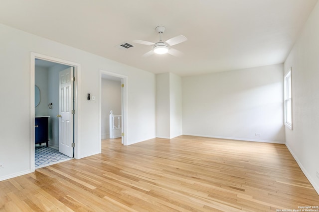 123 W Mandalay, San Antonio, TX 78212 - unfurnished room featuring light wood-style floors, ceiling fan, and baseboards