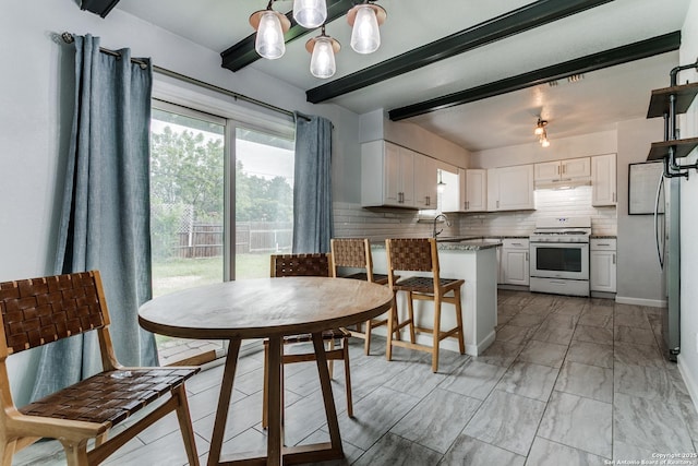 4439 Tropical Dr, San Antonio, TX 78218 - dining area with beam ceiling, a chandelier, and light marble finish floors