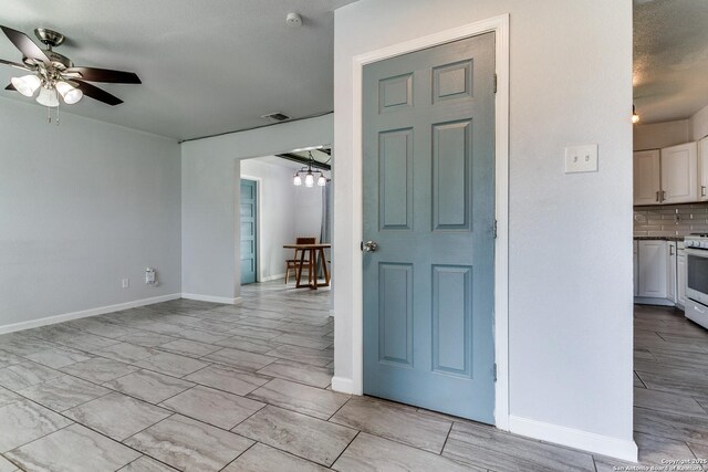 4439 Tropical Dr, San Antonio, TX 78218 - entryway with a ceiling fan, a chandelier, and baseboards