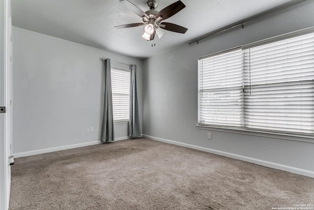4439 Tropical Dr, San Antonio, TX 78218 - unfurnished room featuring a ceiling fan, carpet floors, and baseboards