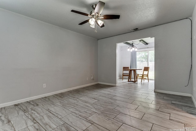 4439 Tropical Dr, San Antonio, TX 78218 - unfurnished room with a ceiling fan, a chandelier, and baseboards