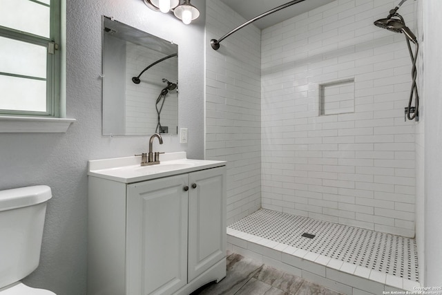 4439 Tropical Dr, San Antonio, TX 78218 - bathroom featuring toilet, a shower stall, and vanity