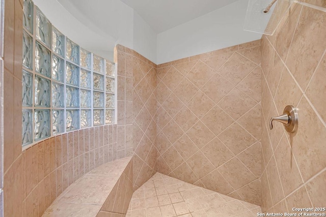 full bath featuring tiled shower