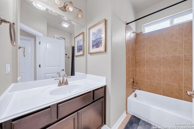 full bathroom featuring shower / tub combination, vanity, tile patterned floors, and baseboards