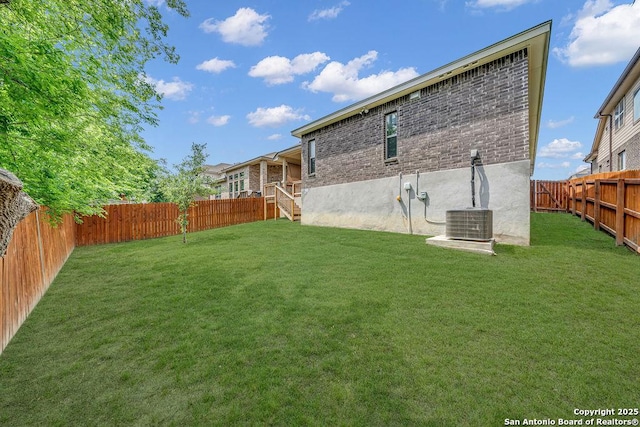 view of yard featuring central AC unit