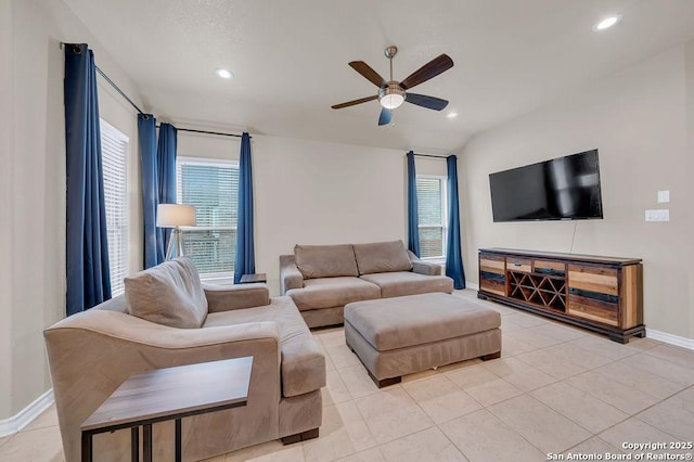 living area with ceiling fan, baseboards, recessed lighting, and light tile patterned floors