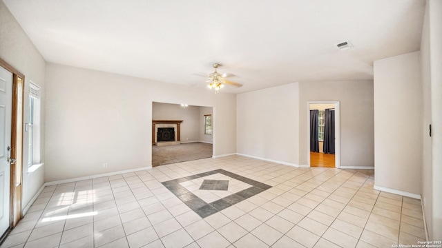 217 Sky View Dr, Adkins, TX 78101 - unfurnished living room featuring light tile patterned floors, a ceiling fan, and baseboards