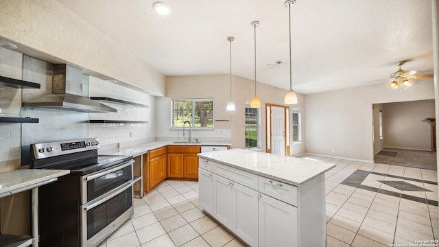 217 Sky View Dr, Adkins, TX 78101 - kitchen with range with two ovens, wall chimney exhaust hood, a sink, light tile patterned floors, and backsplash