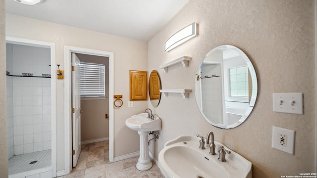 217 Sky View Dr, Adkins, TX 78101 - full bath featuring a sink, a stall shower, and baseboards