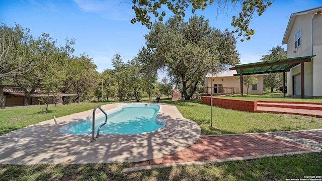 217 Sky View Dr, Adkins, TX 78101 - swimming pool featuring a yard and a patio area