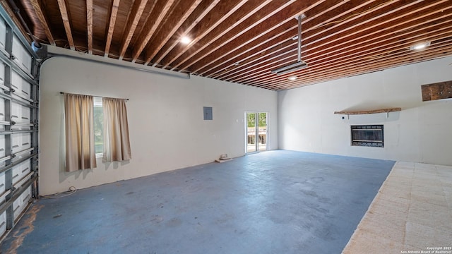 217 Sky View Dr, Adkins, TX 78101 - unfurnished living room with concrete flooring and a glass covered fireplace