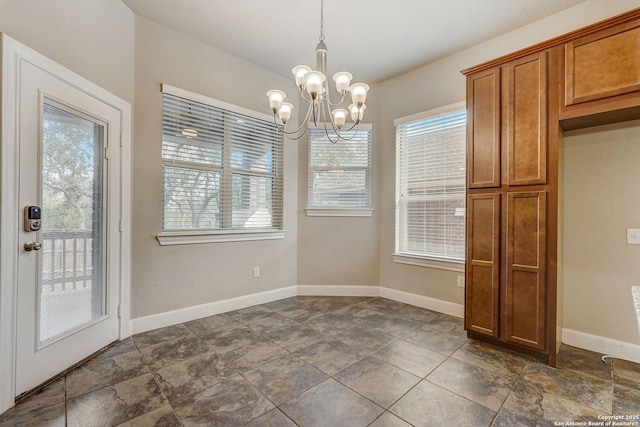 3419 Cherokee, San Antonio, TX 78253 - unfurnished dining area with healthy amount of natural light, a chandelier, baseboards, and dark stone finish flooring