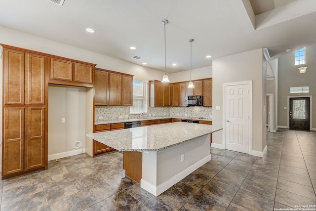 3419 Cherokee, San Antonio, TX 78253 - kitchen with black appliances, brown cabinetry, plenty of natural light, a center island, and recessed lighting