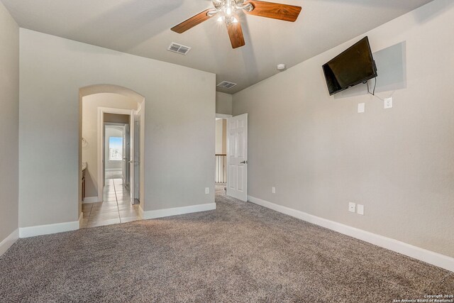 3419 Cherokee, San Antonio, TX 78253 - unfurnished room featuring light carpet, arched walkways, ceiling fan, and baseboards
