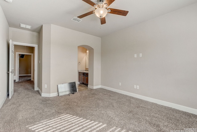 3419 Cherokee, San Antonio, TX 78253 - carpeted empty room with a ceiling fan, arched walkways, baseboards, and a smoke detector