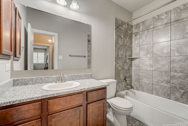3419 Cherokee, San Antonio, TX 78253 - bathroom featuring a textured wall, toilet, vanity, and bathtub / shower combination