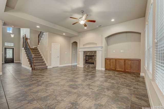 3419 Cherokee, San Antonio, TX 78253 - unfurnished living room featuring ceiling fan, stairway, a tile fireplace, recessed lighting, and baseboards