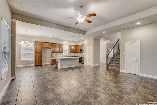 3419 Cherokee, San Antonio, TX 78253 - kitchen featuring black microwave, tasteful backsplash, ceiling fan, baseboards, and a kitchen island