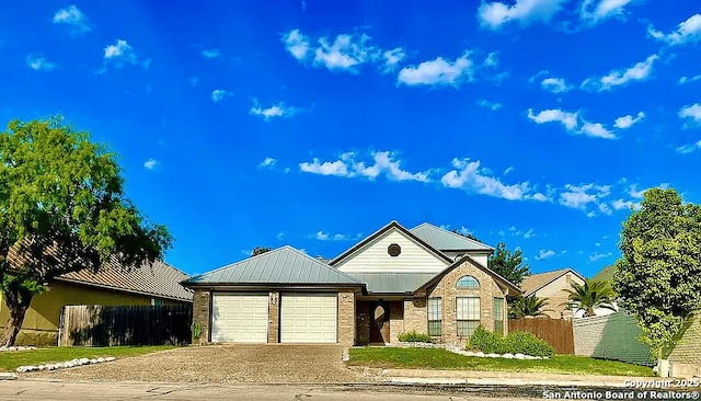 6718 Congressional Blvd, San Antonio, TX 78244 - view of front of house with fence, a garage, driveway, and brick siding