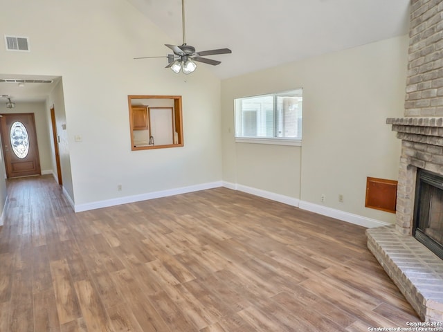 6718 Congressional Blvd, San Antonio, TX 78244 - unfurnished living room featuring a fireplace, a ceiling fan, vaulted ceiling, wood finished floors, and baseboards