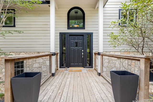 9811 Rebel Queen, San Antonio, TX 78255 - doorway to property with stone siding and a porch