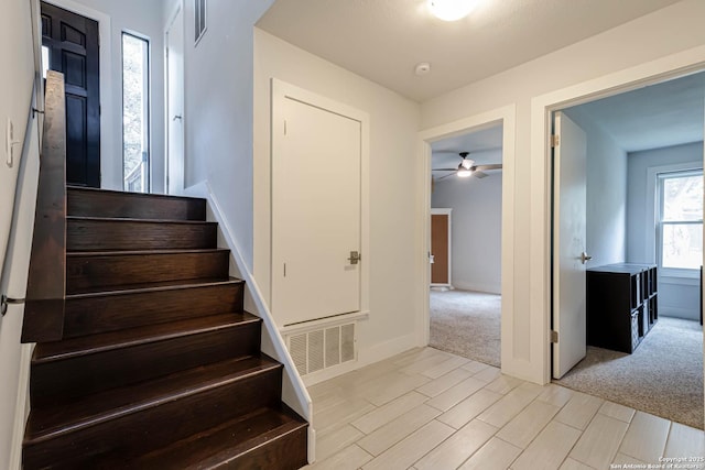 9811 Rebel Queen, San Antonio, TX 78255 - stairs with ceiling fan, wood finish floors, and baseboards