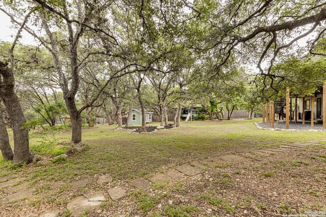 9811 Rebel Queen, San Antonio, TX 78255 - view of green lawn with an outbuilding