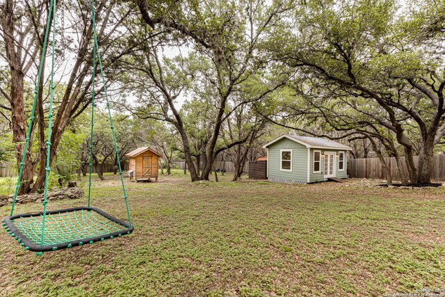 9811 Rebel Queen, San Antonio, TX 78255 - view of yard featuring an outbuilding