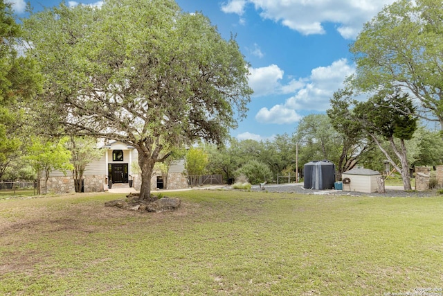 9811 Rebel Queen, San Antonio, TX 78255 - view of grassy yard featuring a shed and an outbuilding
