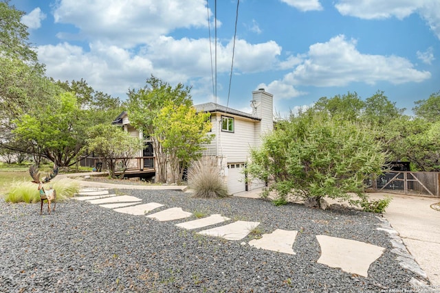 9811 Rebel Queen, San Antonio, TX 78255 - view of yard with a deck, an attached garage, and driveway