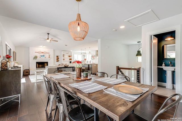 9811 Rebel Queen, San Antonio, TX 78255 - dining area with ceiling fan, a fireplace, dark wood-style flooring, plenty of natural light, and recessed lighting